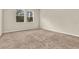 Bright bedroom featuring neutral walls, carpet, and double windows at 3773 Moon Dancer Pl, St Cloud, FL 34772