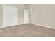 Neutral carpeted bedroom with a closet featuring white bi-fold doors at 3773 Moon Dancer Pl, St Cloud, FL 34772