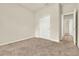 Carpeted bedroom featuring a closet with sliding doors at 3773 Moon Dancer Pl, St Cloud, FL 34772