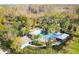 Aerial view of community pool area surrounded by palm trees and lush greenery at 3773 Moon Dancer Pl, St Cloud, FL 34772