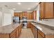 Spacious kitchen featuring granite countertops, stainless steel appliances and center island at 3773 Moon Dancer Pl, St Cloud, FL 34772