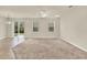 Bright and airy living room featuring large windows and sliding glass doors to the backyard at 3773 Moon Dancer Pl, St Cloud, FL 34772