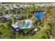 Aerial view of community pool and lake with houses in the background at 3773 Moon Dancer Pl, St Cloud, FL 34772