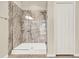 Close-up of a marbled glass shower next to a built-in closet at 3773 Moon Dancer Pl, St Cloud, FL 34772