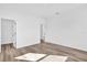 Empty bedroom with wood-style flooring and ample closet space at 42 Fisher Way Trak, Ocklawaha, FL 32179