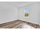 Bright bedroom features a window with natural light and wood-look floors at 42 Fisher Way Trak, Ocala, FL 34473