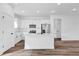 Bright kitchen features white cabinets, modern appliances, and a large center island at 42 Fisher Way Trak, Ocklawaha, FL 32179