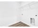 Laundry room with hook-ups, wire shelving, and wood-look floors at 42 Fisher Way Trak, Ocklawaha, FL 32179