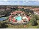 Aerial view of community, pool, and tennis courts at 4401 Messina Dr, Lake Mary, FL 32746