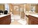 Large bathroom with double vanity, soaking tub and shower at 4401 Messina Dr, Lake Mary, FL 32746