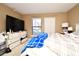 Spacious bedroom with large TV and ample storage at 4401 Messina Dr, Lake Mary, FL 32746