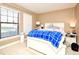 Bright bedroom with window, carpet, and neutral walls at 4401 Messina Dr, Lake Mary, FL 32746