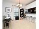Open concept dining area with four bar stools and a view to the kitchen at 4401 Messina Dr, Lake Mary, FL 32746