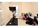Bright home office with exercise bike and shoe storage at 4401 Messina Dr, Lake Mary, FL 32746