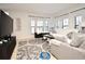 Living room with ample natural light, neutral decor, and comfy sofas at 4401 Messina Dr, Lake Mary, FL 32746