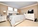 Main bedroom with king bed and white dresser at 4401 Messina Dr, Lake Mary, FL 32746
