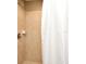 Shower with beige tile and white curtain at 4401 Messina Dr, Lake Mary, FL 32746