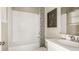 Clean bathroom with white tile, bathtub, and vanity at 5702 Gingham Dr, Kissimmee, FL 34758