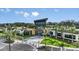 Modern community center with palm trees and landscaping at 5702 Gingham Dr, Kissimmee, FL 34758