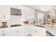 Modern kitchen with white cabinets, stainless steel appliances, and a large island at 5702 Gingham Dr, Kissimmee, FL 34758