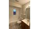 Clean bathroom with a bathtub, toilet and vanity at 6432 Delta Leah Dr, Orlando, FL 32818
