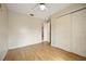 Bright bedroom with wood flooring and double door closet at 6432 Delta Leah Dr, Orlando, FL 32818