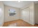 Simple bedroom with wood flooring and double door closet at 6432 Delta Leah Dr, Orlando, FL 32818