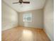 Spacious bedroom with light wood laminate flooring and ceiling fan at 6432 Delta Leah Dr, Orlando, FL 32818