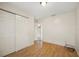 Bedroom with wood floors and access to another room at 6432 Delta Leah Dr, Orlando, FL 32818