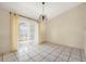 Bright dining room featuring tile floors and sheer curtains at 6432 Delta Leah Dr, Orlando, FL 32818