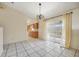 Dining area with tile floors and access to the kitchen at 6432 Delta Leah Dr, Orlando, FL 32818