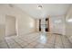 Living room with tile floors and an interior door at 6432 Delta Leah Dr, Orlando, FL 32818