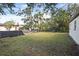 This home features a spacious backyard with a chainlink fence, perfect for outdoor activities at 878 Rockhill St, Deltona, FL 32725