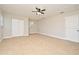 Cozy bedroom featuring plush carpeting, a ceiling fan, and natural light at 878 Rockhill St, Deltona, FL 32725