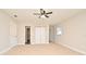 Spacious bedroom with carpet, closet, and a ceiling fan at 878 Rockhill St, Deltona, FL 32725