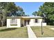Charming single-story home with a well-maintained lawn and neutral-colored exterior at 878 Rockhill St, Deltona, FL 32725