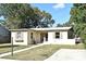 Charming single-story home with a well-maintained lawn and classic architectural details at 878 Rockhill St, Deltona, FL 32725