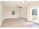Bright living room featuring modern gray flooring and a ceiling fan at 878 Rockhill St, Deltona, FL 32725