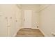 Mud room with vinyl floors, utility sink, storage shelf, and exterior access door at 878 Rockhill St, Deltona, FL 32725