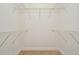 A very large walk-in closet with carpet flooring and metal shelving at 878 Rockhill St, Deltona, FL 32725