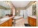 Bathroom featuring double sinks, garden tub, and glass shower at 402 Turnstone Way, Orlando, FL 32828