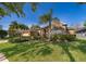 Inviting home exterior with a brick facade, large window, manicured shrubs, and a lush green lawn at 402 Turnstone Way, Orlando, FL 32828