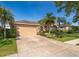 Lovely home featuring a two-car garage and well-manicured front lawn, showcasing curb appeal and inviting entrance at 402 Turnstone Way, Orlando, FL 32828