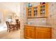 Hallway near the kitchen and dining area with charming display cabinets at 402 Turnstone Way, Orlando, FL 32828