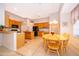 Eat-in kitchen features an island and black appliances at 402 Turnstone Way, Orlando, FL 32828
