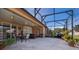 Spacious screened lanai offering space for dining and relaxing in a comfortable setting at 402 Turnstone Way, Orlando, FL 32828