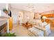 Open-concept living area features a fireplace and flows seamlessly into the kitchen at 402 Turnstone Way, Orlando, FL 32828