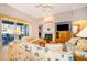 Bright living room with fireplace, ceiling fan and sliding glass doors to the outside patio at 402 Turnstone Way, Orlando, FL 32828