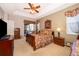 Well-lit main bedroom with walkout to outdoor living space at 402 Turnstone Way, Orlando, FL 32828