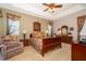 Spacious main bedroom with floral accents and abundant natural light at 402 Turnstone Way, Orlando, FL 32828